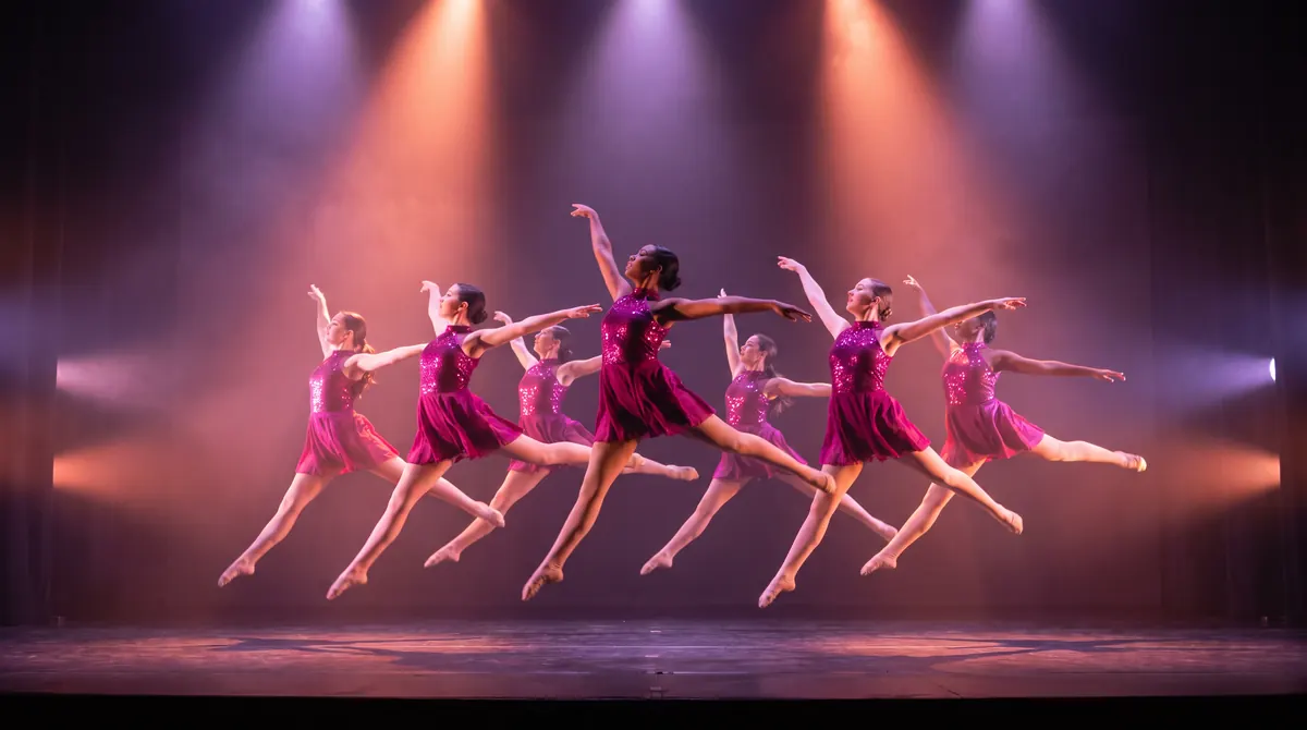 A competition dance team performing on stage